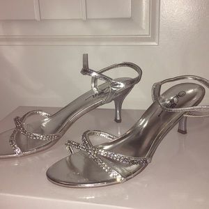 Silver high heels.